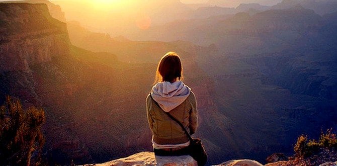 Girl-sitting-alone-on-cliff